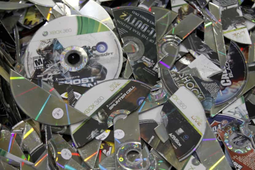 Game discs brought to GameStop's refurbishment center to be shredded and recycled because of...