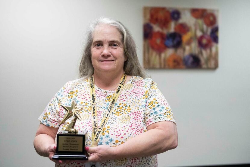 Yvonne Smeltze poses for a photo with the STAR Paraprofessional of the Year award. She won...
