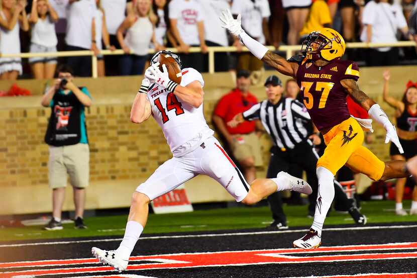 LUBBOCK, TX - SEPTEMBER 16: Dylan Cantrell #14 of the Texas Tech Red Raiders makes the catch...