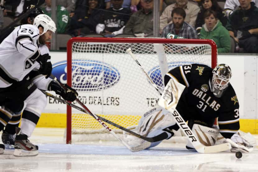 Dallas Stars goalie Richard Bachman (31) deflects a shot on goal in a game against the Los...