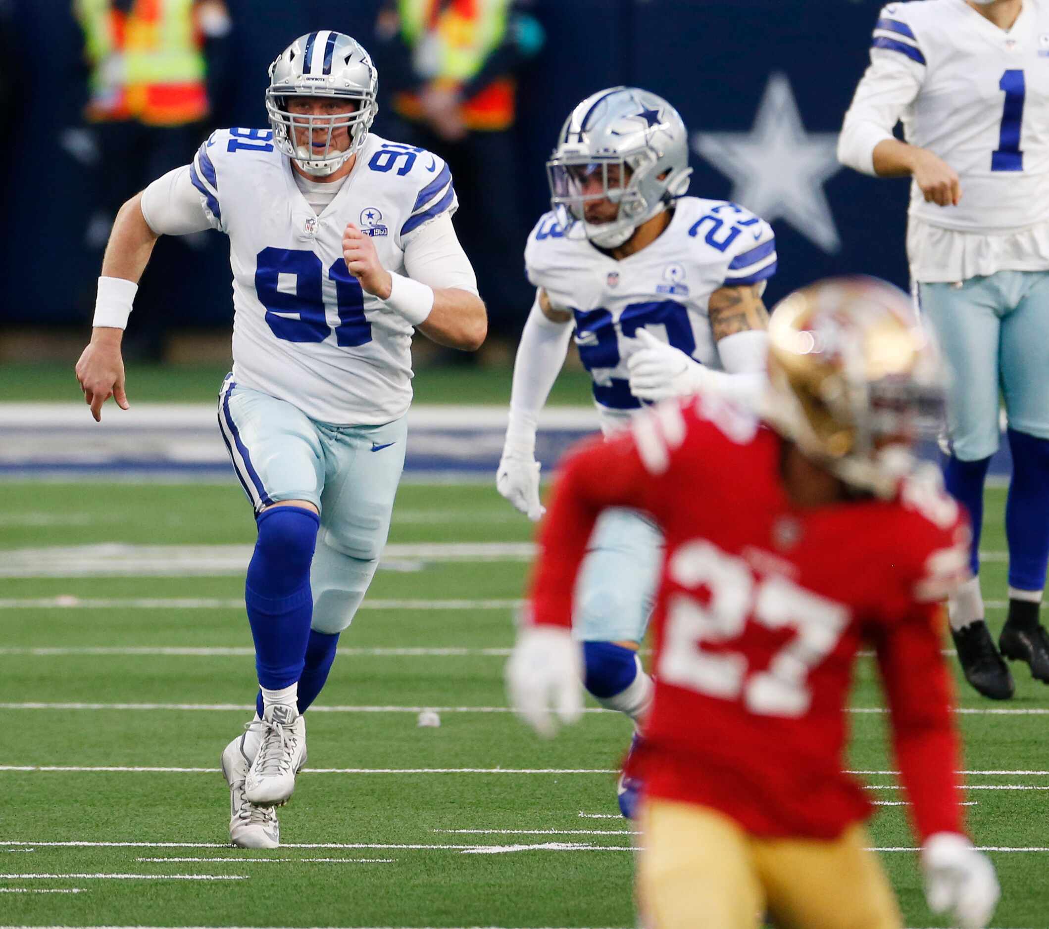 Dallas Cowboys long snapper L.P. LaDouceur (91) runs up the field on a punt play in a game...