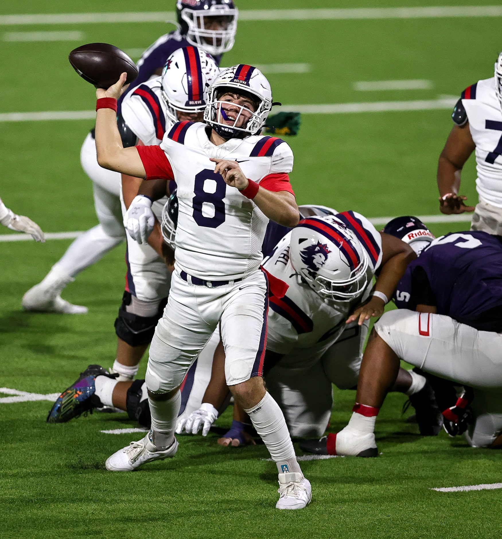 Richland quarterback Drew Kates (8) tries to get off a pass  against Denton Ryan during the...