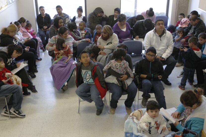 People waited in line to get a flu shot at Dallas County Health and Human Services on...