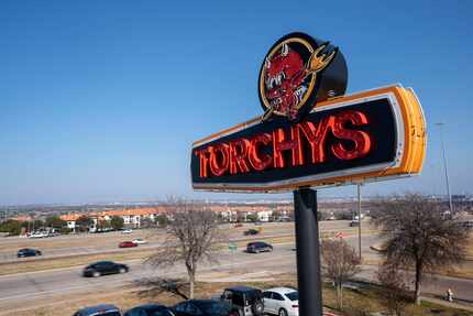 Cars pass by Torchy’s Tacos on Interstate 635 in the Las Colinas/Irving area.