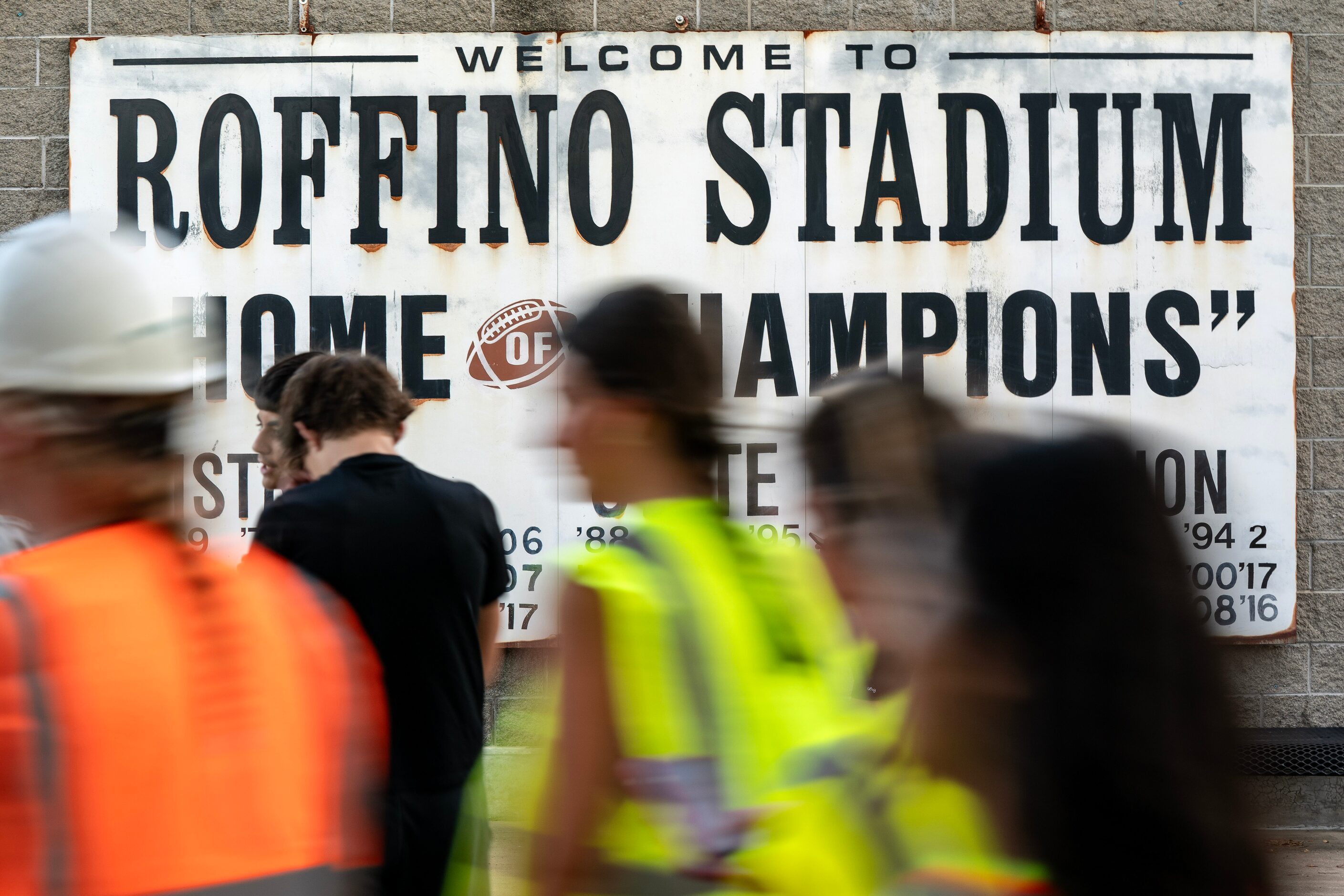 Fans enter Roffino Stadium before a high school football game between Bishop Lynch and...