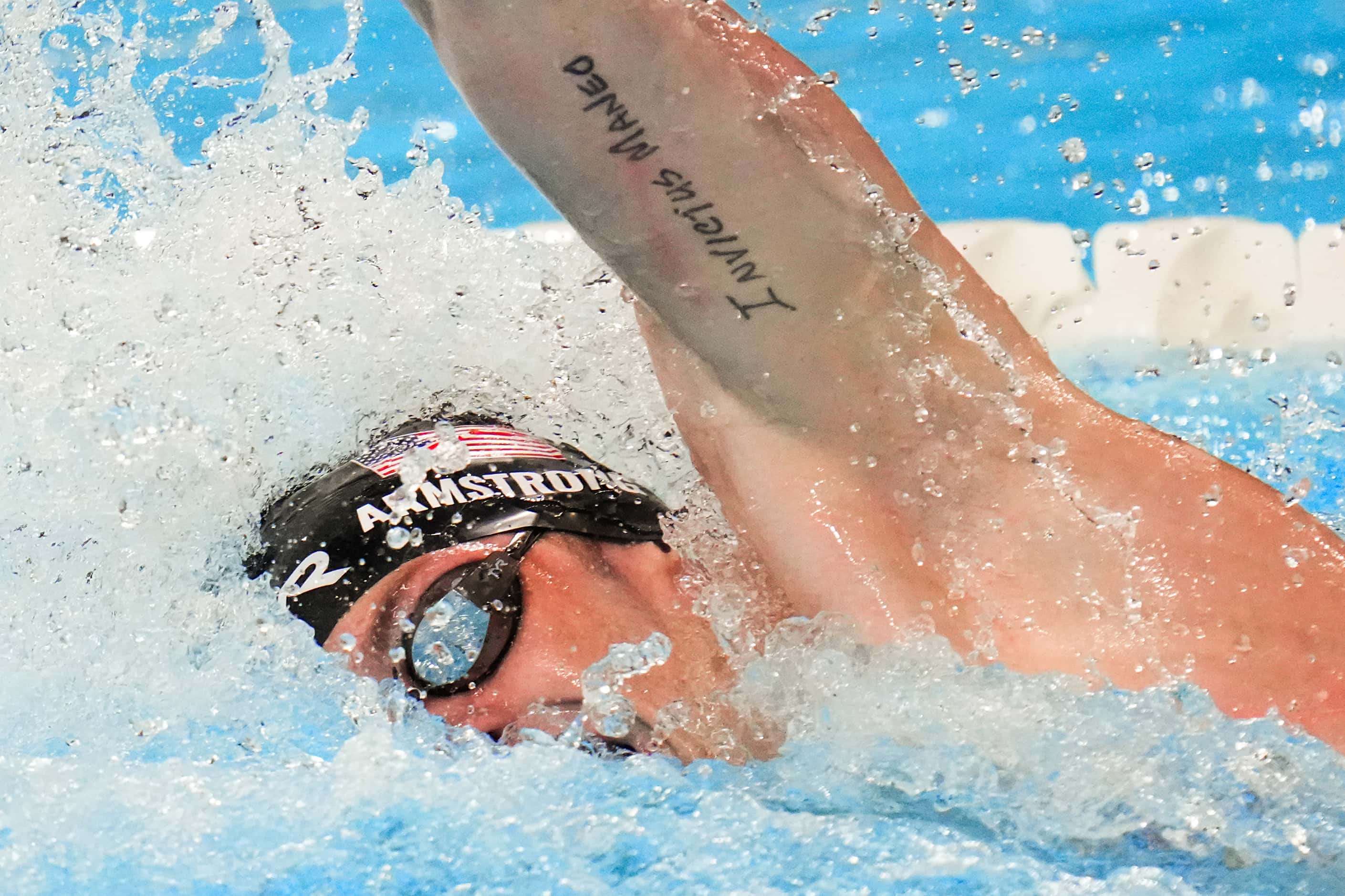 Hunter Armstrong of the United States swims a leg of his team’s gold medal winning men’s...