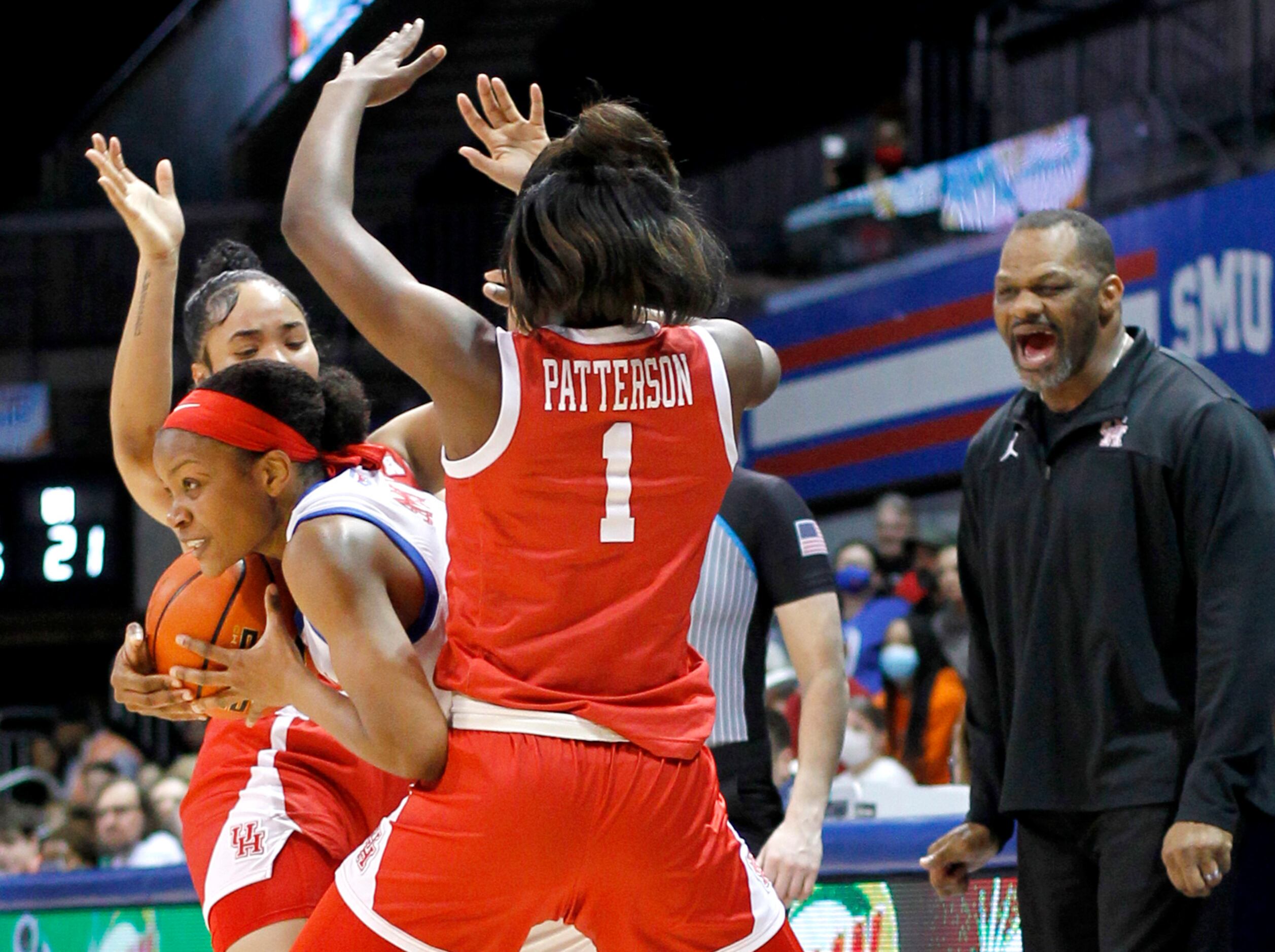 SMU guard Jasmine Smith (10), center left, works out of the aggressive defense of Houston...