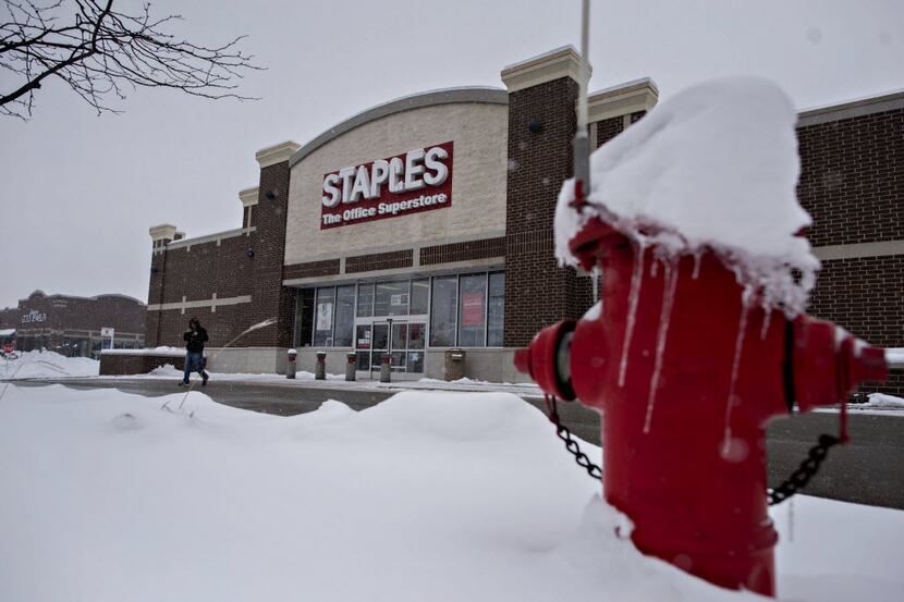 A customer exits a Staples Inc. store in Frankfort, Illinois, U.S., on Wednesday, Feb. 4,...