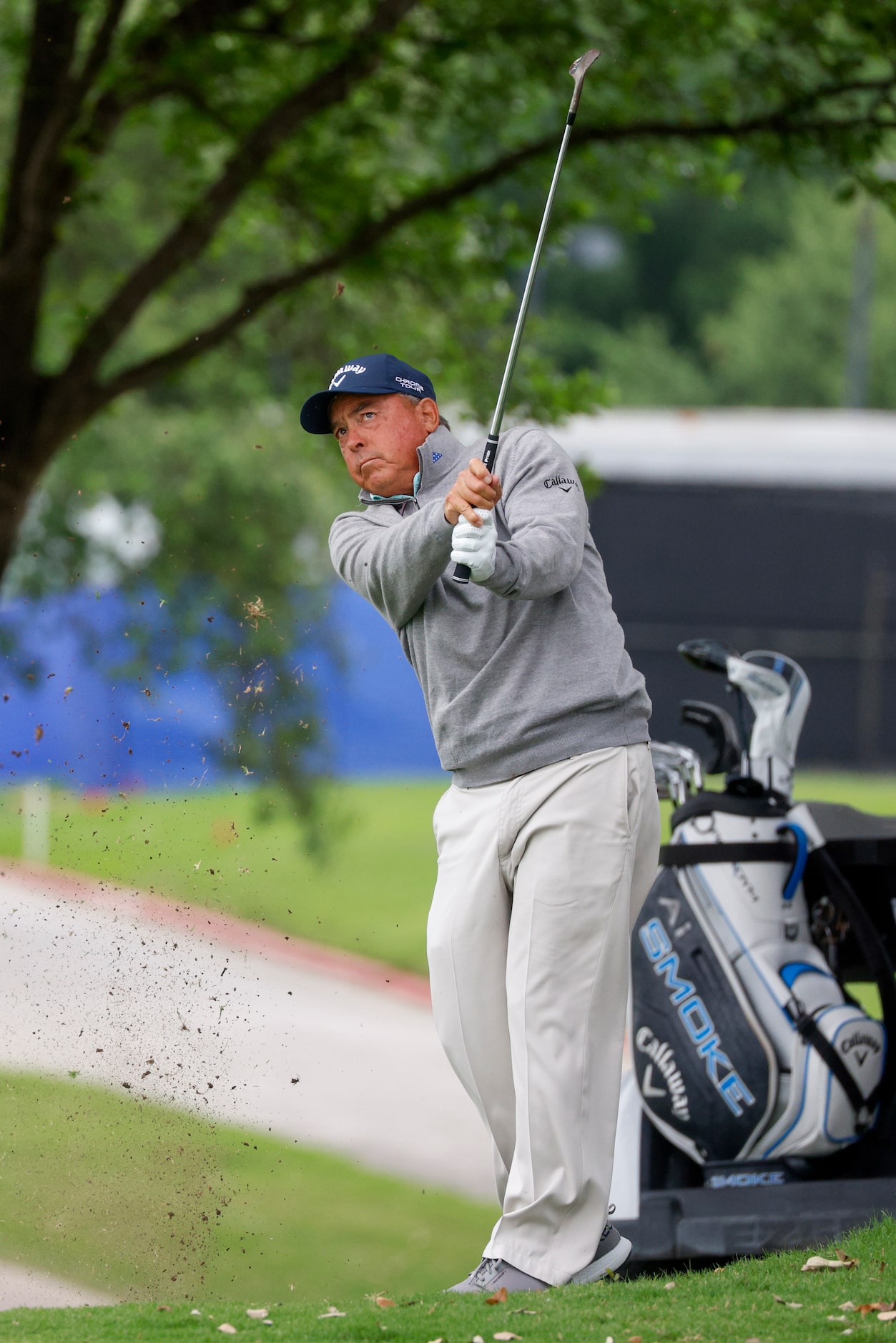 Professional golfer Olin Browne plays a shot on the 18th fairway during the first round of...