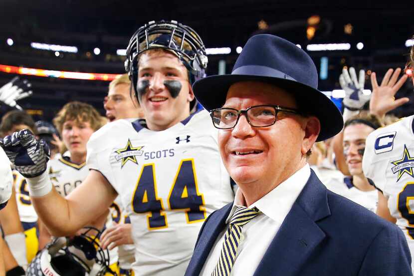 Highland Park football coach Randy Allen celebrates with his players after defeating...