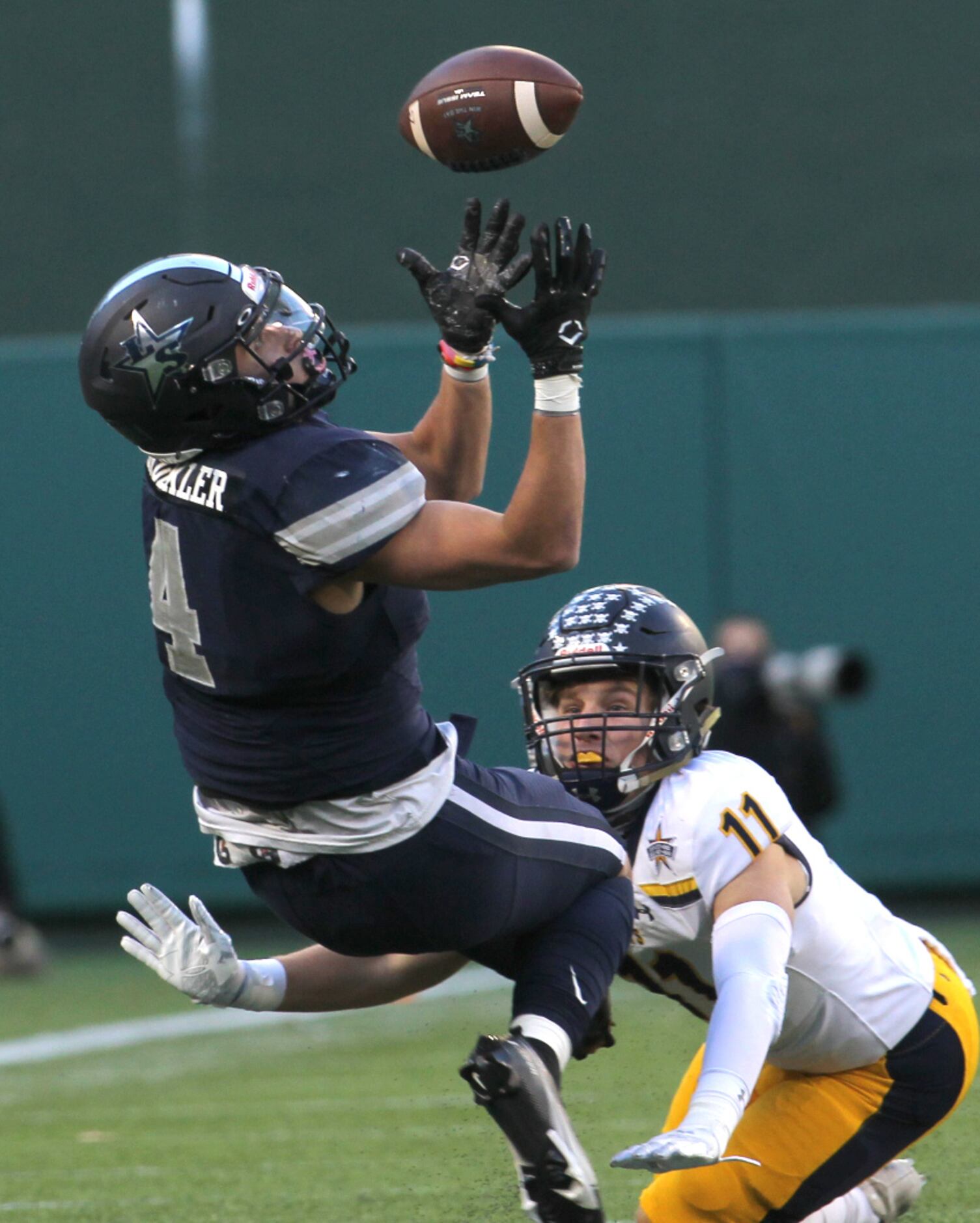 Frisco Lone Star receiver Trace Bruckler (4) shows great concentration as he focuses to pull...