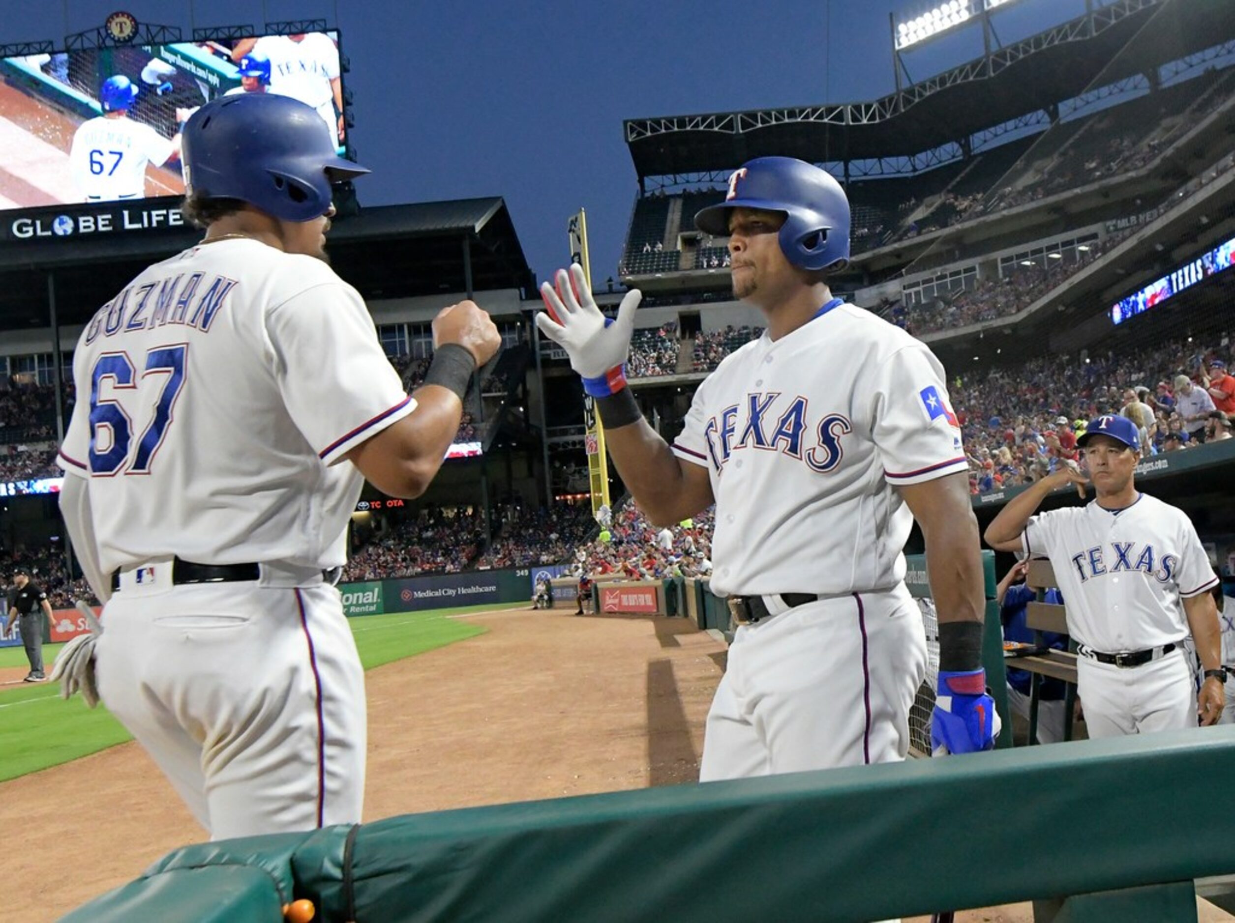 Texas Rangers designated hitter Adrian Beltre (29) congratulates first baseman Ronald Guzman...