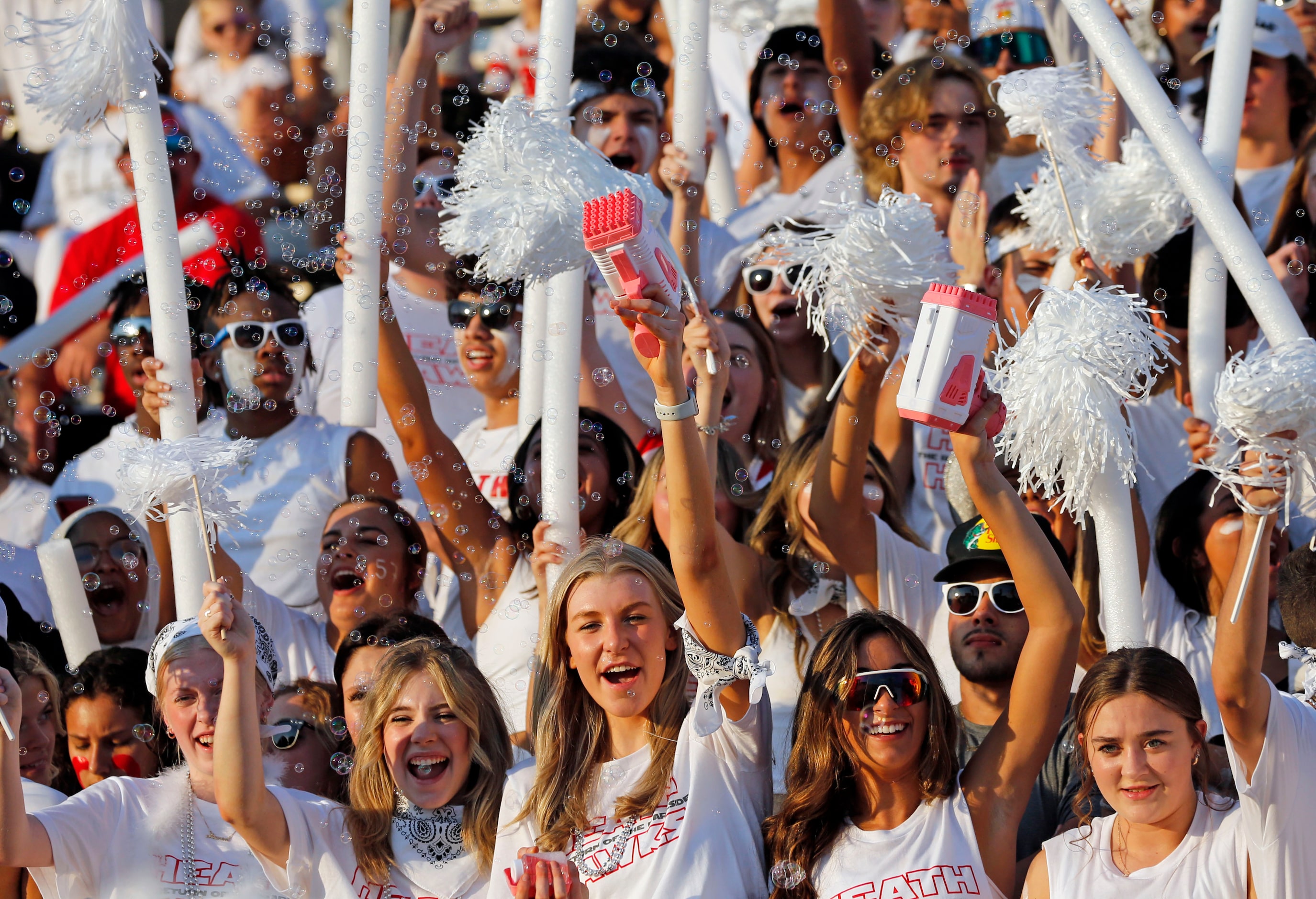 Rockwall-Heath high fans cheer in the stands, using bubble-making machines, during the first...