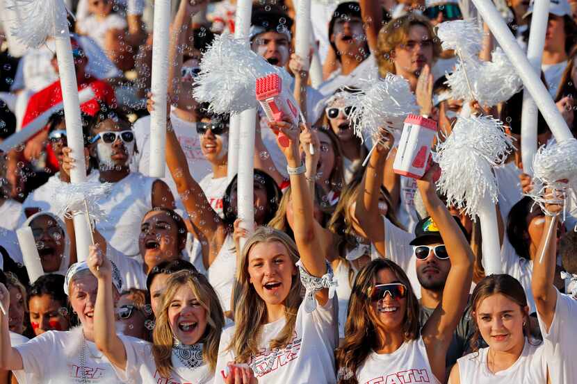Rockwall-Heath high fans cheer in the stands, using bubble-making machines, during the first...