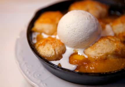 The Texas peach cobbler at Billy Can Can comes with brown-butter drop biscuits and...