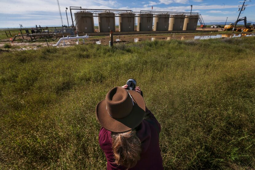 Sharon Wilson, a senior organizer for Earthworks, records infrared footage of emissions from...