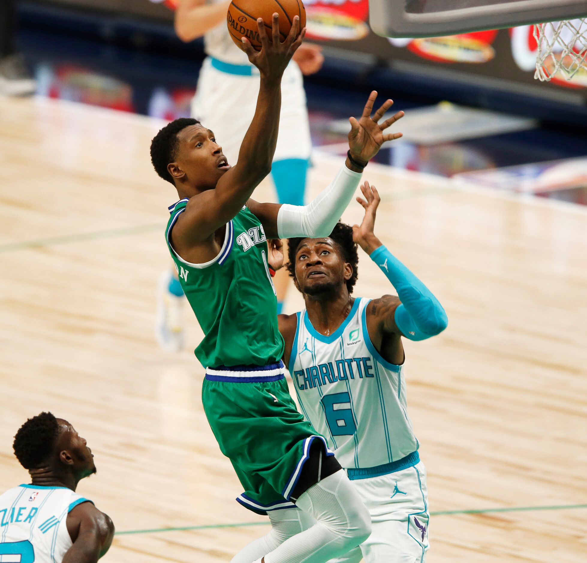 Dallas Mavericks guard Josh Richardson (0) attempts a shot in front of Charlotte Hornets...