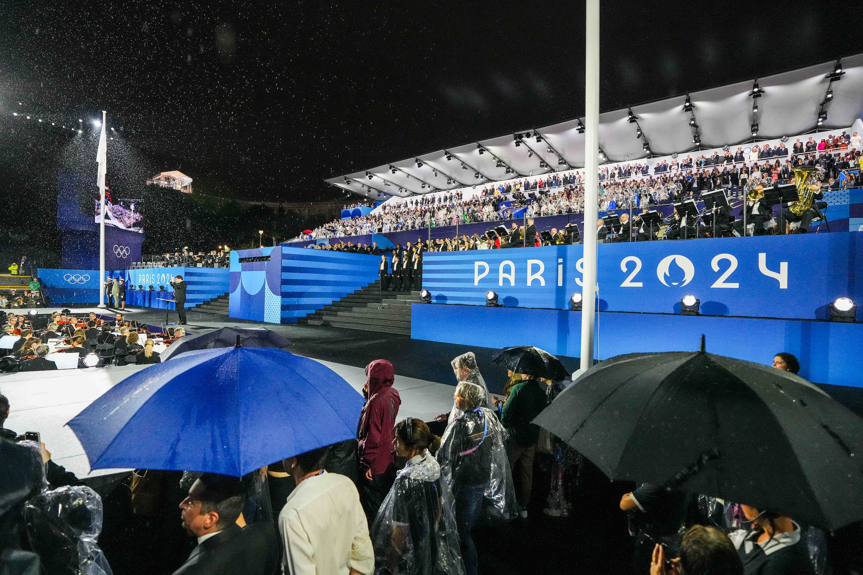 The Olympic flag is raised during opening ceremonies for the 2024 Summer Olympics on Friday,...