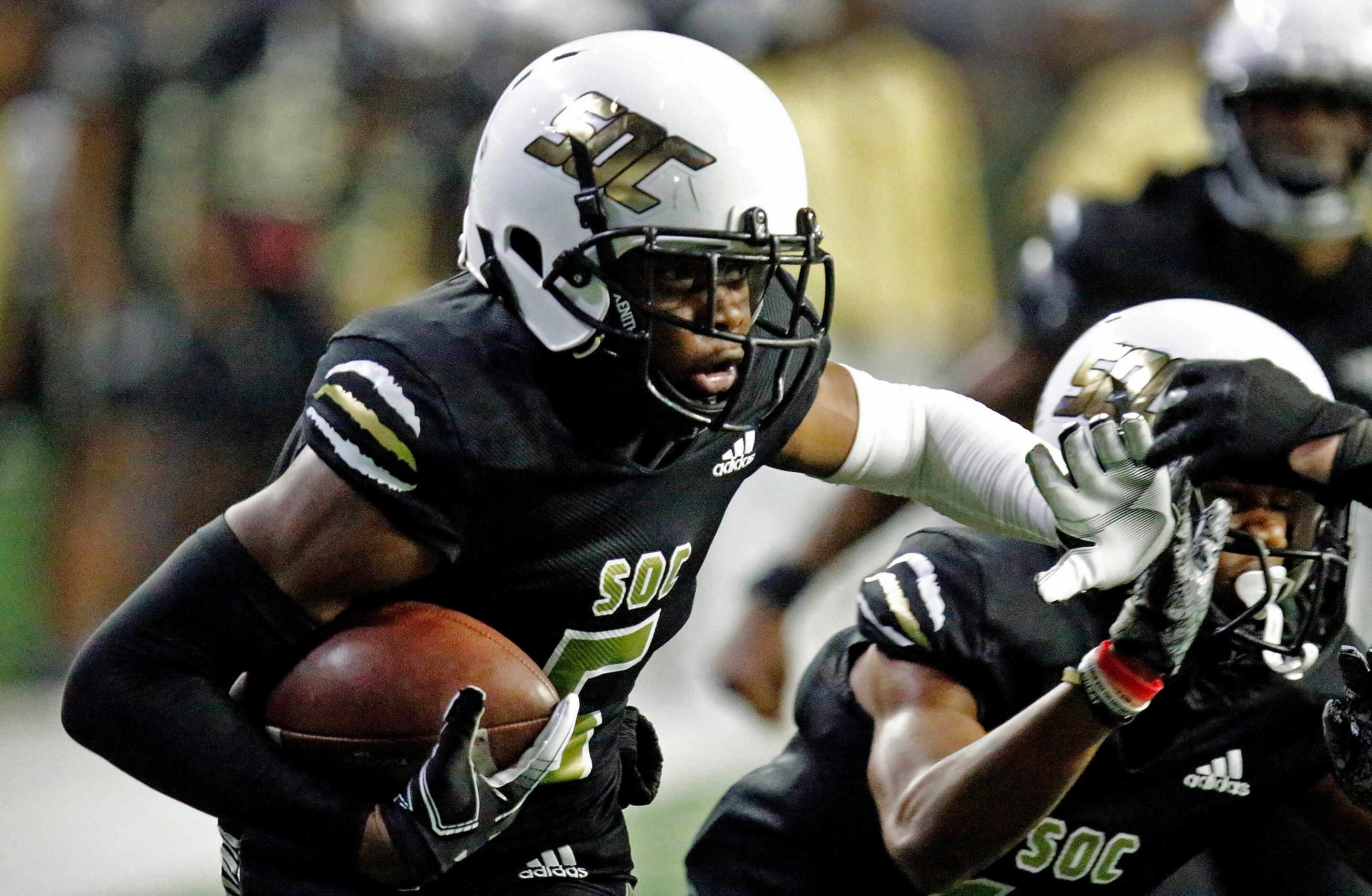 South Oak Cliff High School wide receiver Randy Reece (5) makes a run after the catch during...