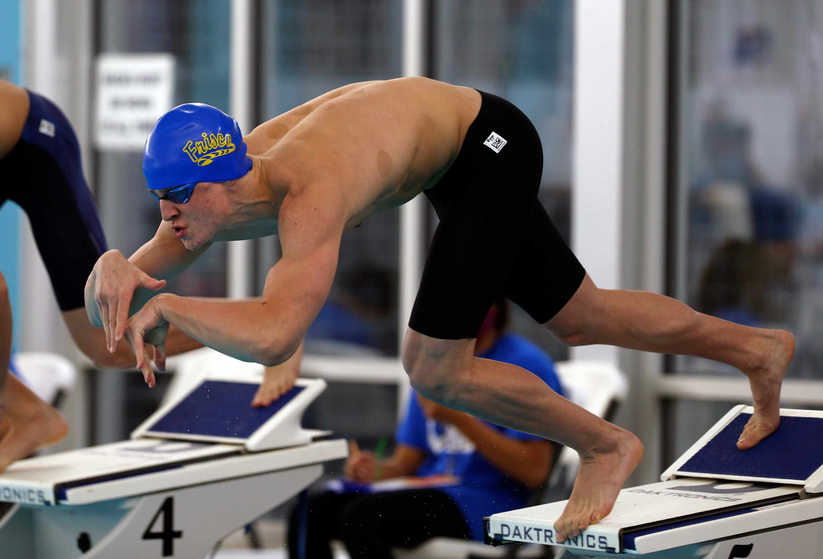 Frisco's Jon VanZandt takes off in the 50 yard freestyle. UIL boys 5A swim finals on...