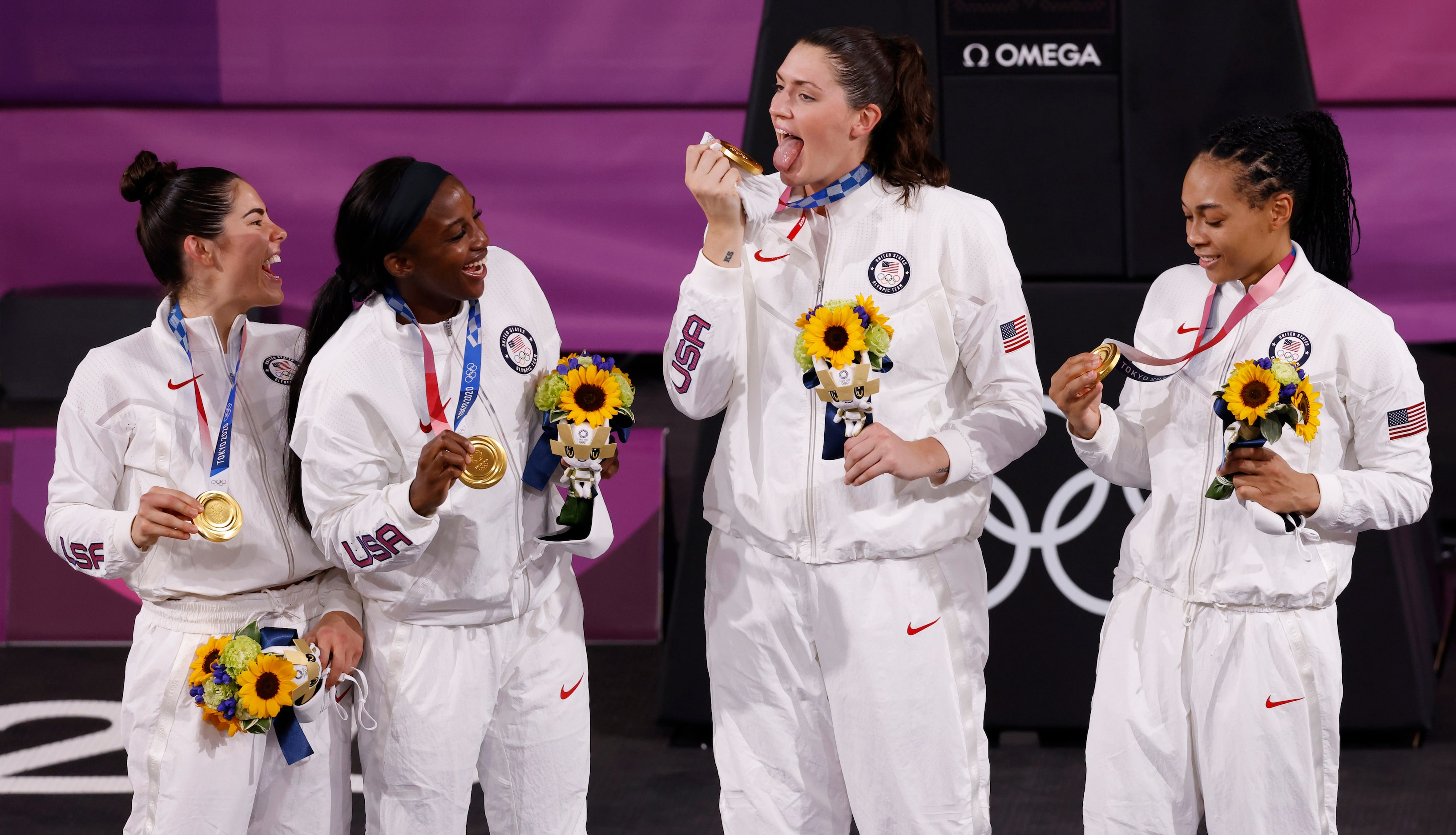 USA’s Kelsey Plum (5), Jacquelyn Young (8), Stefanie Dolson (13), and Allisha Gray (15) pose...