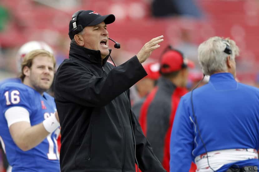 SMU head coach June Jones gestures towards the field against Rutgers in the second half of...