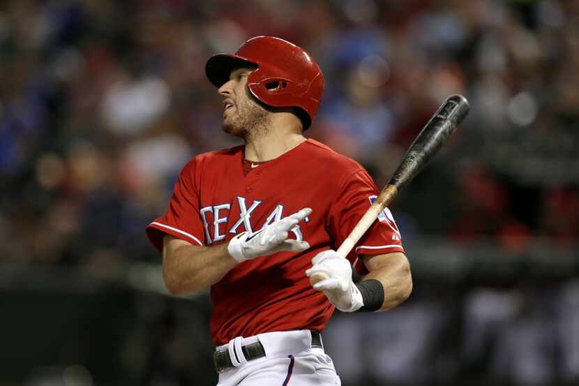 FILE - In this Aug. 31, 2013, file photo, Texas Rangers' Ian Kinsler follows through on a...