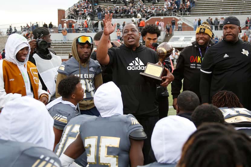 South Oak Cliff head coach Jason Todd speaks with his players after being presented the...