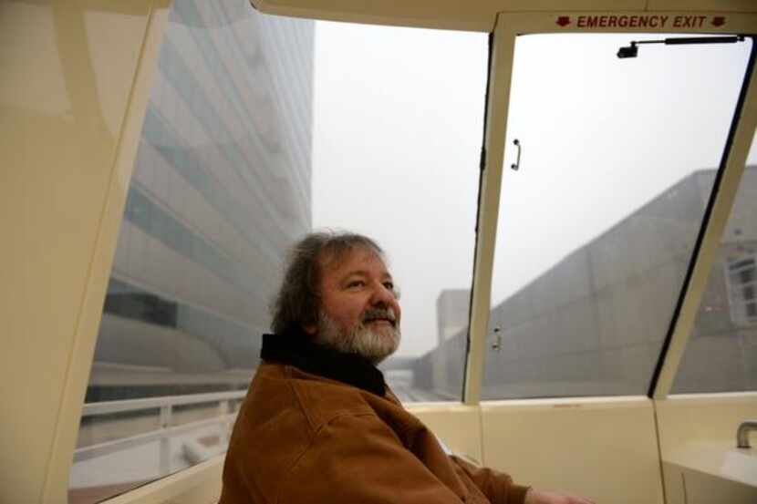 Commuter Earl Thames  rides the Las Colinas Area Personal Transit System in Las Colinas. The...