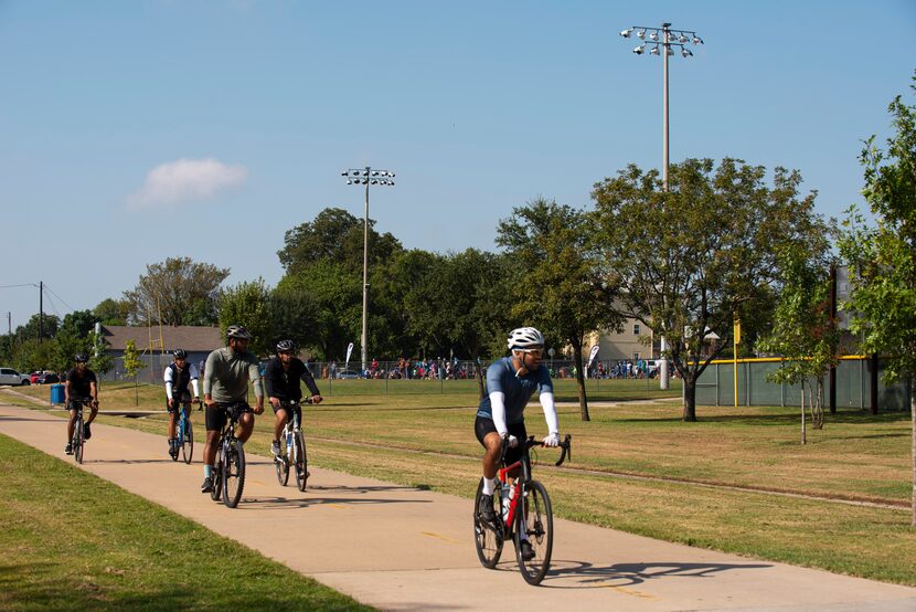 Bikers ride Saturday on the popular Santa Fe Trail, which runs along the southern edge of...