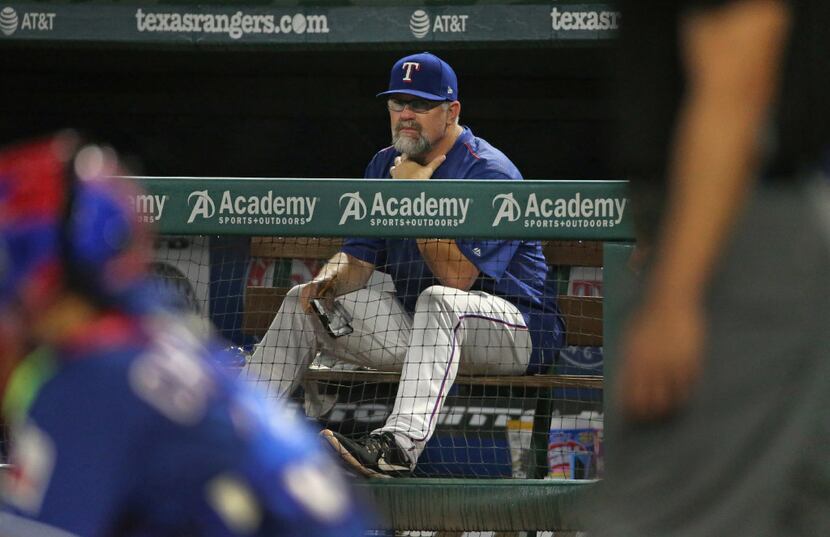 Texas Rangers pitching coach Doug Brocail (46) is pictured in the dugout during the Seattle...