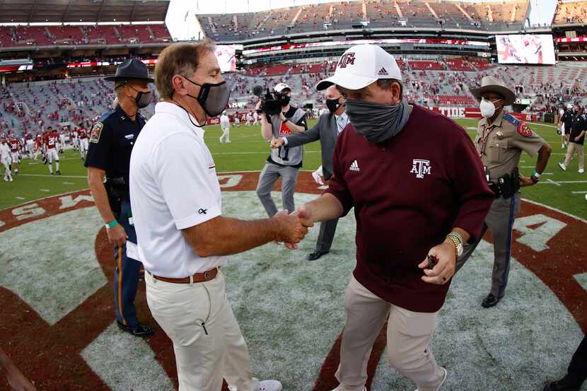 TUSCALOOSA, AL - OCTOBER 3: Nick Saban of the Alabama Crimson Tide shakes hands with Jimbo...