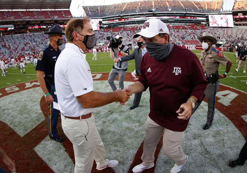 TUSCALOOSA, AL - OCTOBER 3: Nick Saban of the Alabama Crimson Tide shakes hands with Jimbo...