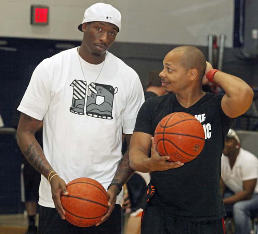 Josh Howard of the Utah Jazz shoots with DJ Red before the fourth annual "Ballin with the...