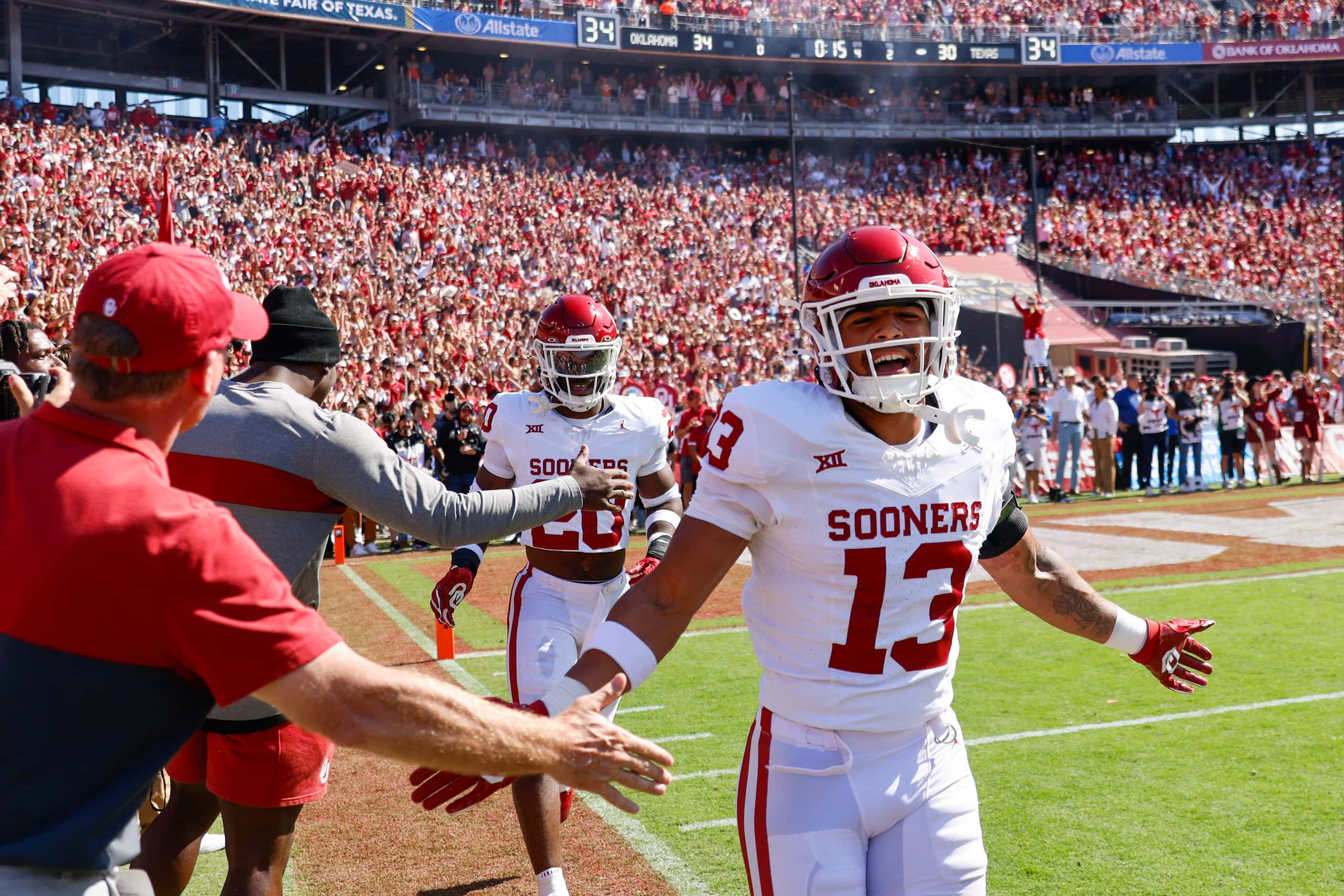 Oklahoma linebacker Shane Whitter cheers along the sideline after Oklahoma takes the lead...