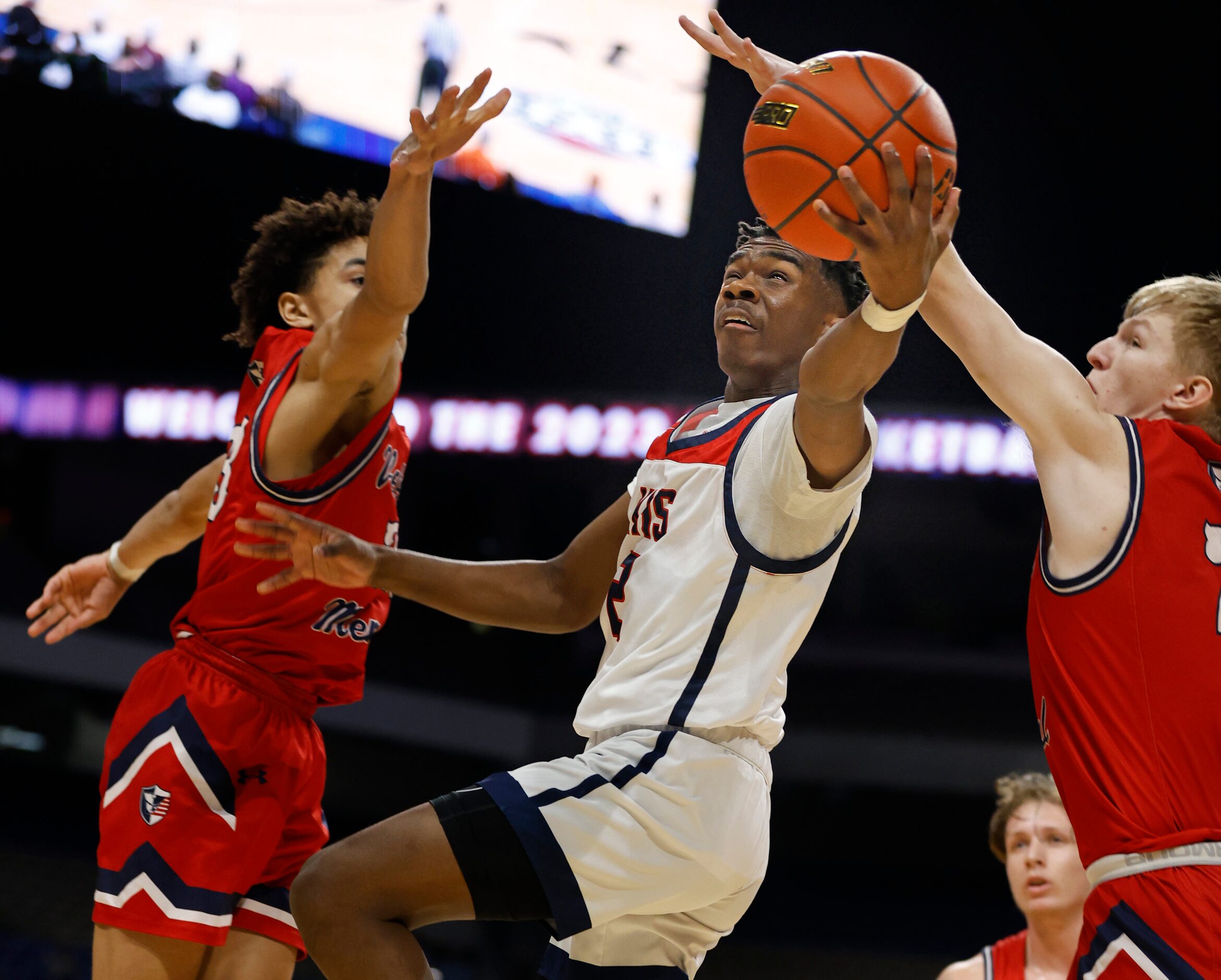 Dallas Kimball T’Johnn Brown (2) drives by two defenders during San Antonio Veterans...