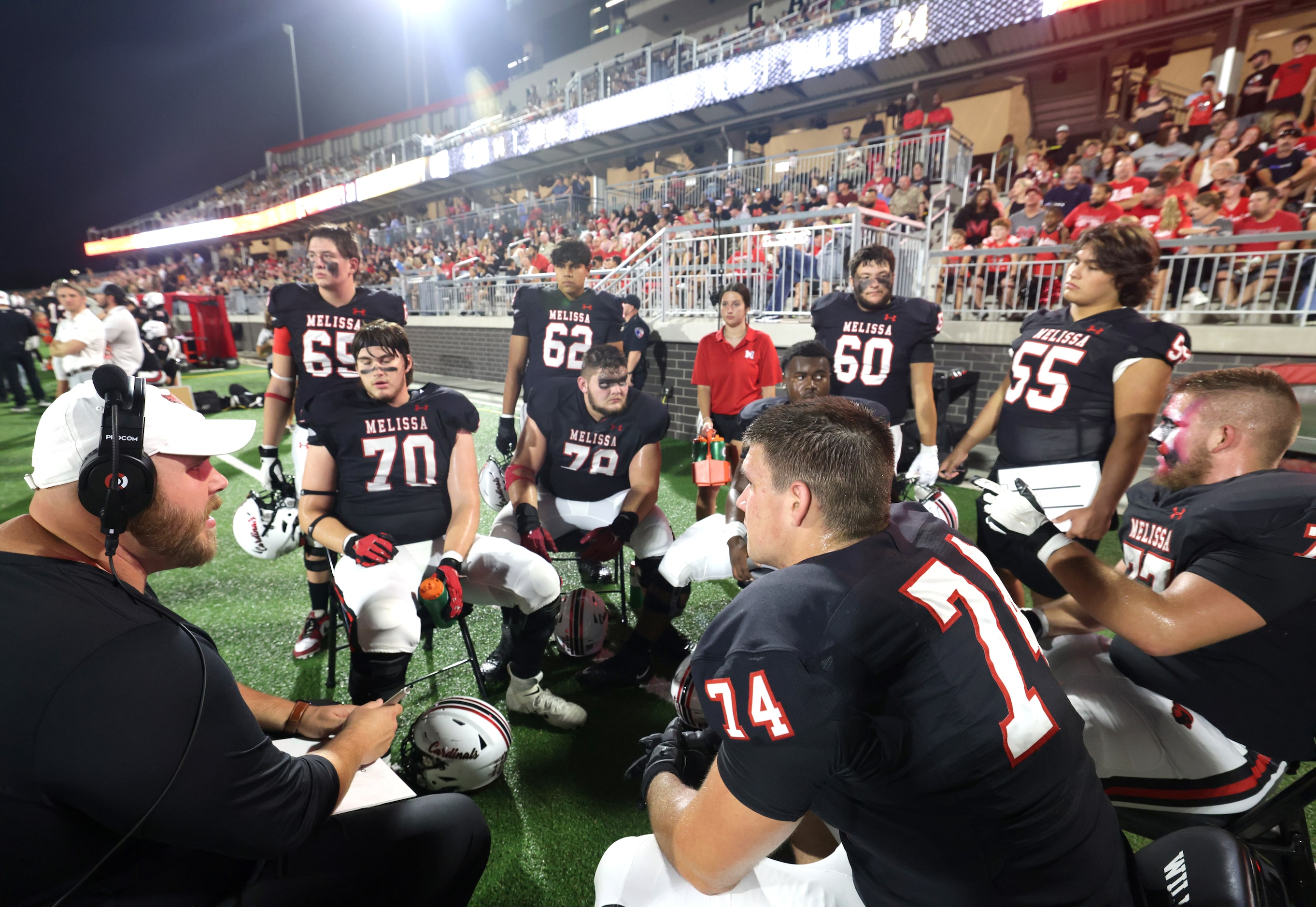 Melissa team members huddle up during the Frisco Memorial High School at Melissa High School...