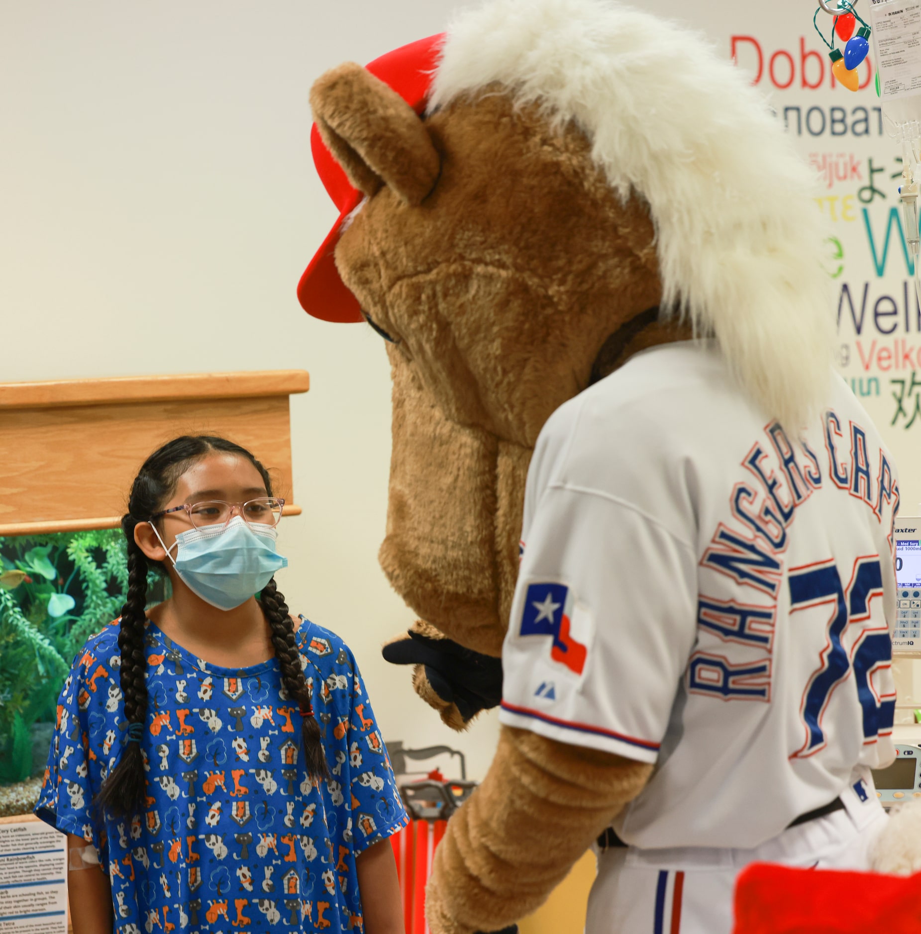 Yasmine Lopez, 8, interacts with Rangers Captain at Medical City Children’s Hospital,...