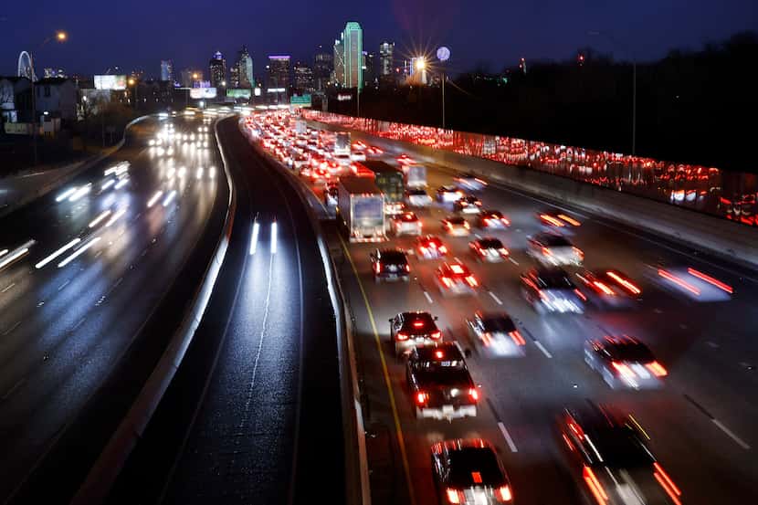 Traffic is backed up on eastbound Interstate 30 (right) as it approaches downtown Dallas,...