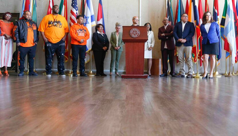 Dallas police Chief Eddie Garcia, center, joins City Council members and community leaders...