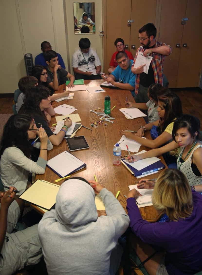 Students take part in a note-taking exercise during the Dallas Urban Debate Alliance Summer...