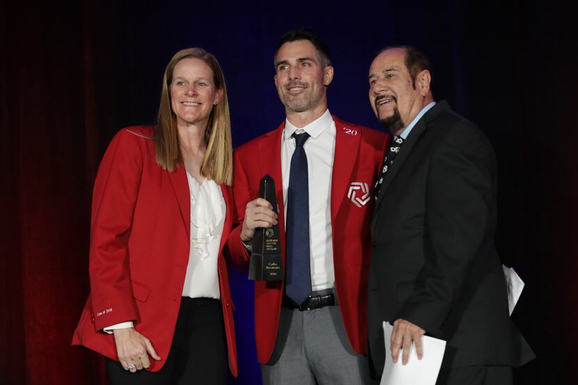Cindy Parlow Cone, left, Carlos Bocanegra, and Manuel Bocanegra pose during the National...
