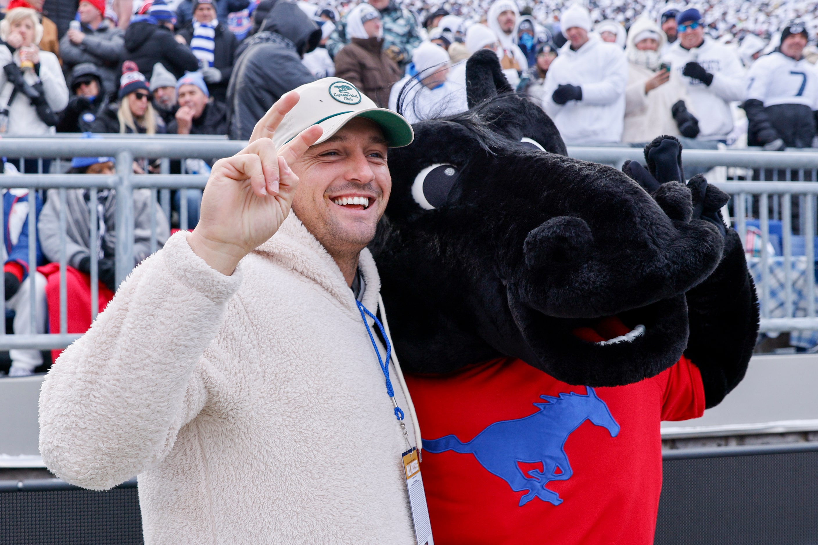 SMU alumnus and professional golfer Bryson DeChambeau poses for a photo with SMU mascot...