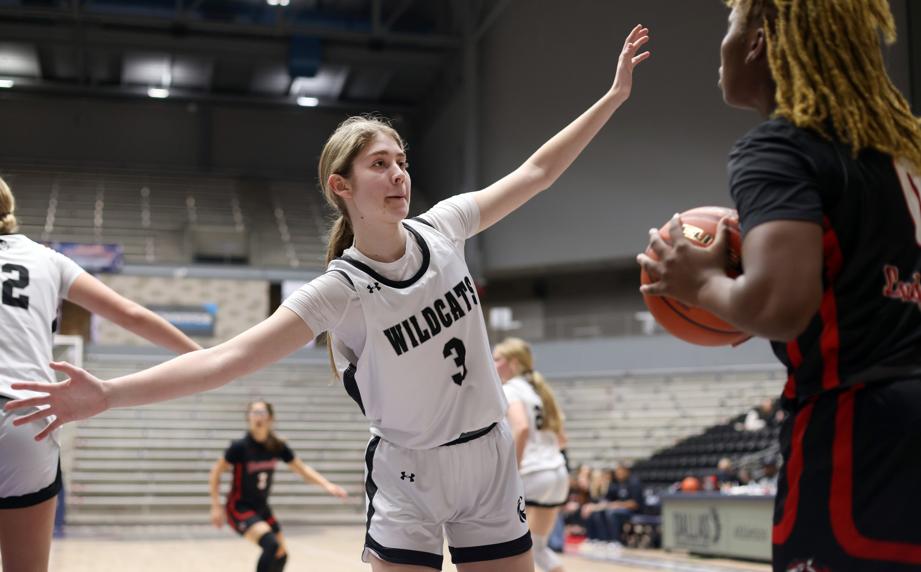 Denton Guyer guard Madison McGhie (3), center, defends a throw-in from Denton Braswell guard...