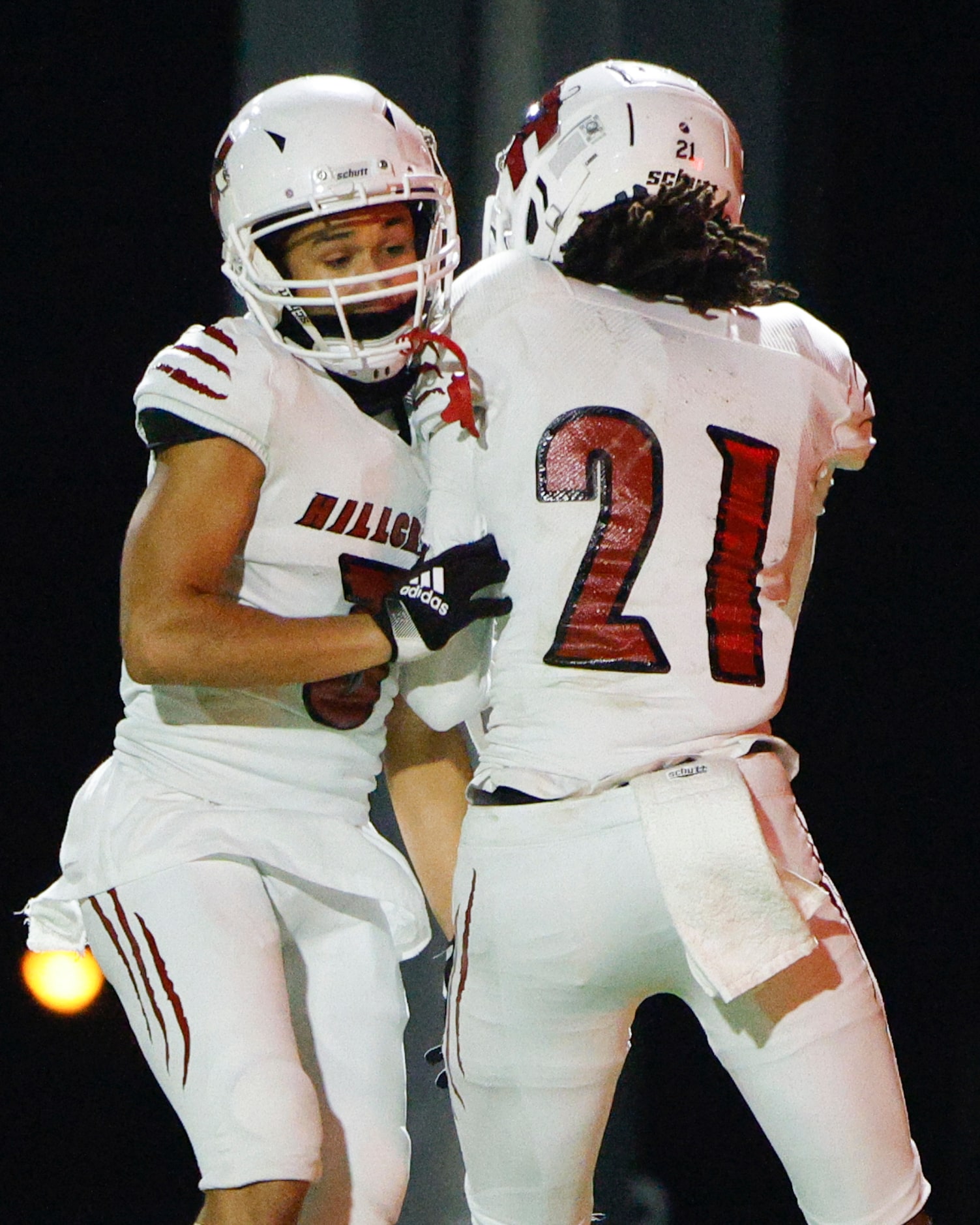 Hillcrest wide receiver Adian Lewis (21) celebrates his touchdown with wide receiver Zion...