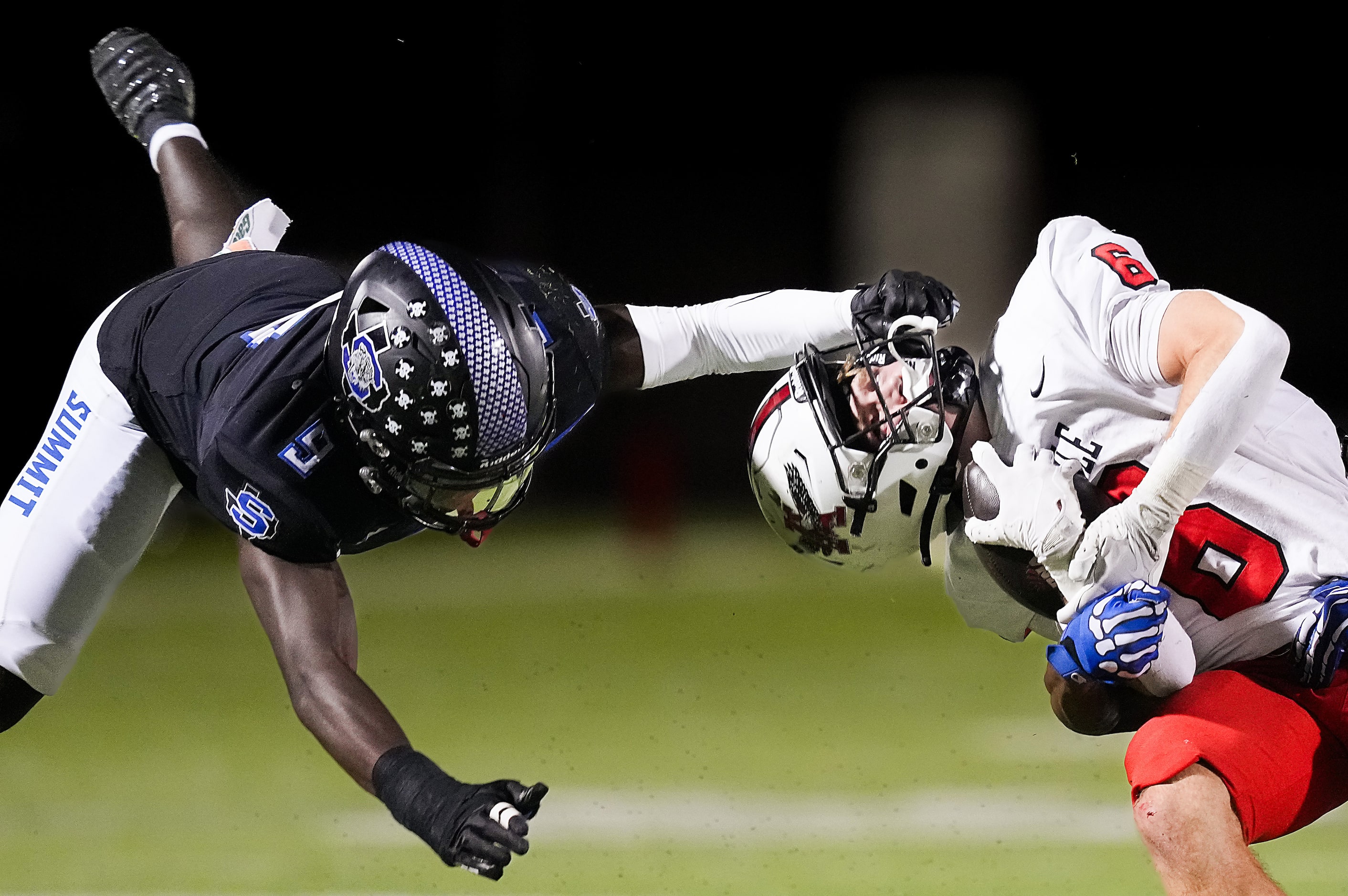 Argyle running back Watson Bell (6) is pulled backwards on a facemask penalty by Mansfield...