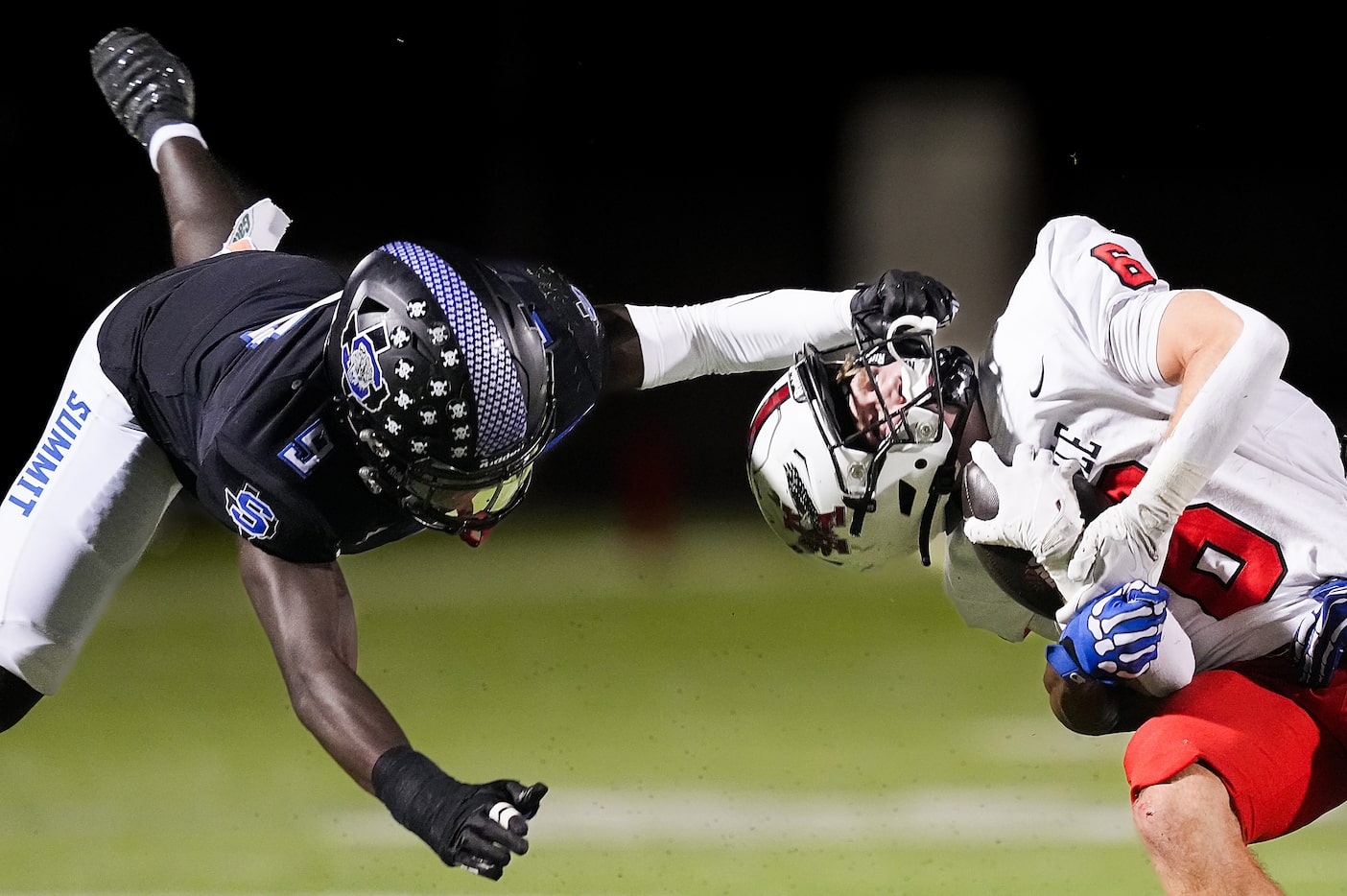 Argyle running back Watson Bell (6) is pulled backwards on a facemask penalty by Mansfield...