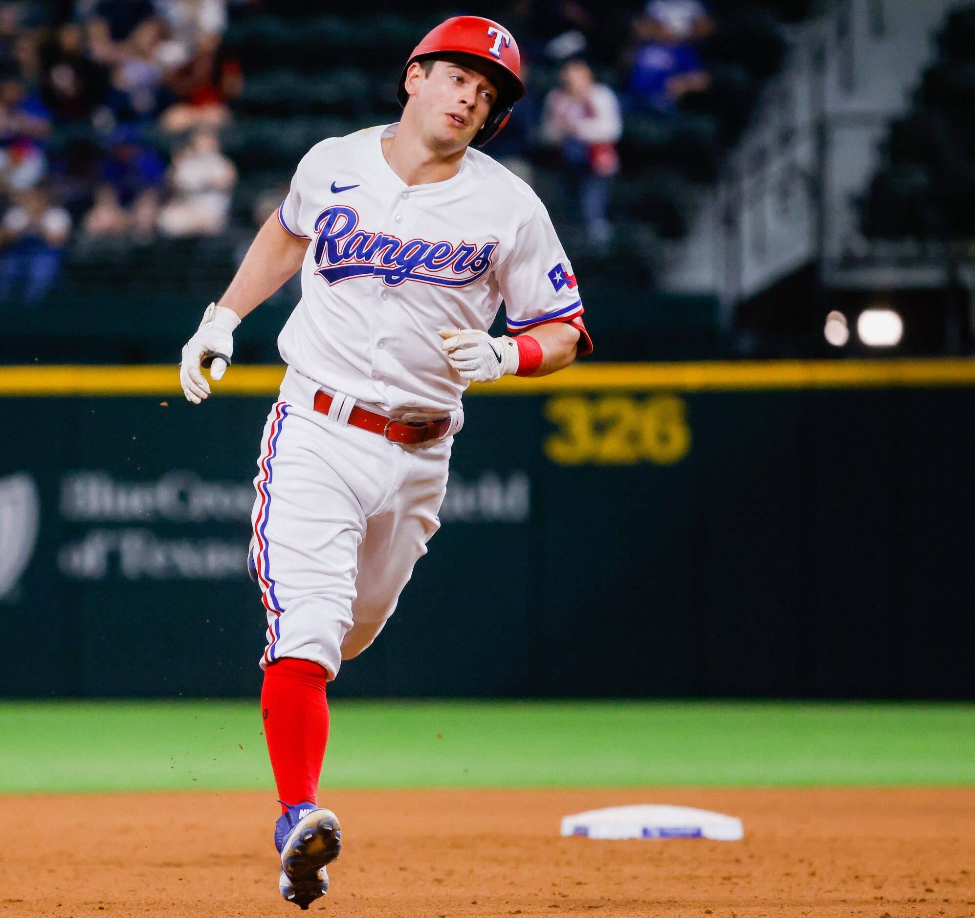 Texas Rangers second baseman Nick Solak (15) runs the bases after hitting a homer on a fly...