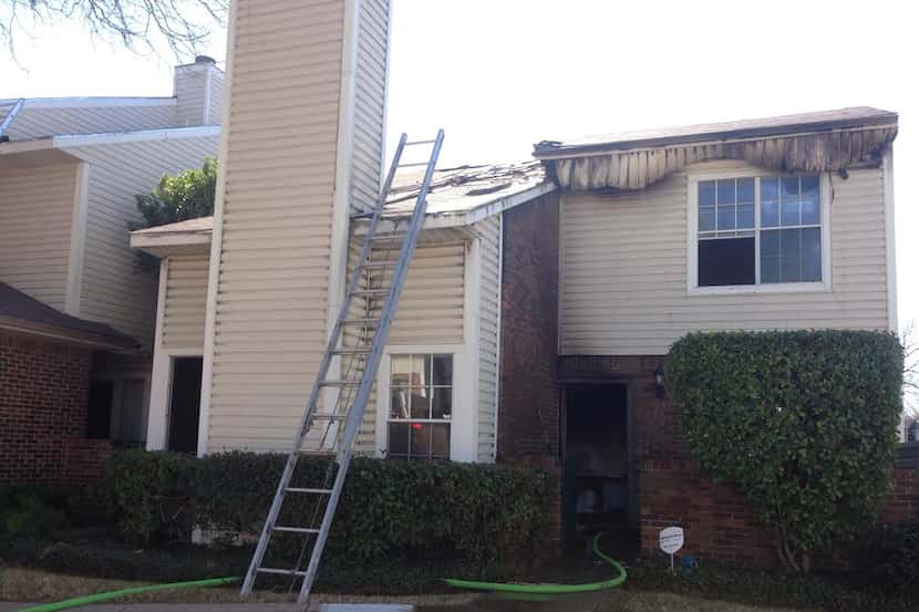  The fire forced a family out of their townhome in Lewisville. (Eline de Bruijn/Staff...