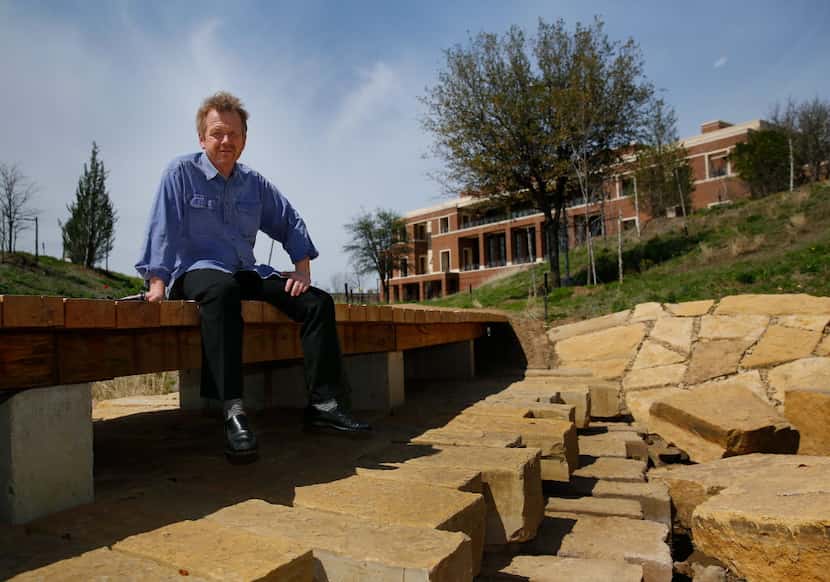 Landscape architect Michael Van Valkenburgh is photographed on a wooden walkway that...